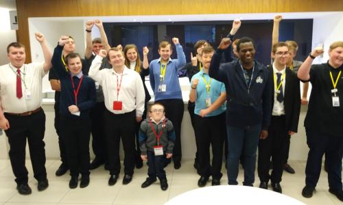 EmployAbility interns celebrating with hands in the air - used for the National Grid story 'EmployAbility supported internships: helping young people with learning disabilities get into employment'