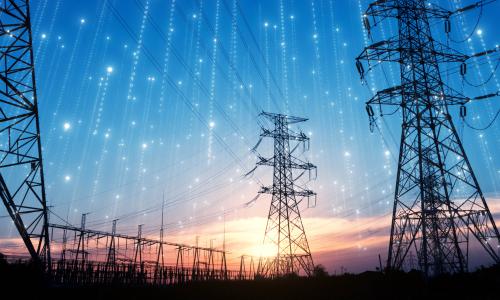 Electricity pylons against sunset for National Grid Partners investing in SparkCognition