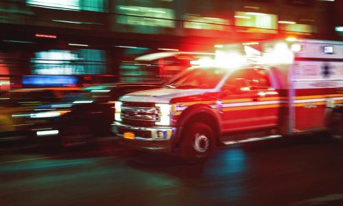 Blurred image of a US ambulance in motion - used for the National Grid story 'Powering healthcare in New York'