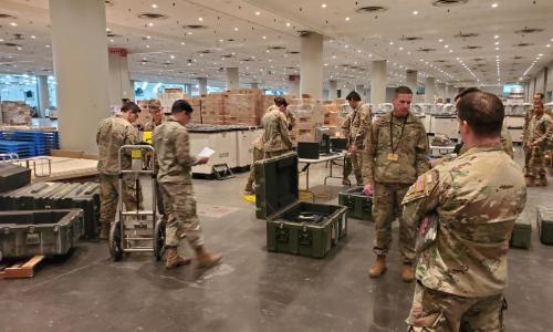 US military personnel in warehouse serving for National Guard - used for 'From National Grid to National Guard' story