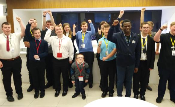 EmployAbility interns celebrating with hands in the air - used for the National Grid story 'EmployAbility supported internships: helping young people with learning disabilities get into employment'