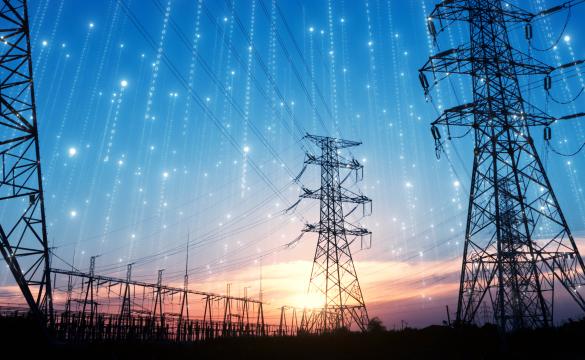 Electricity pylons against sunset for National Grid Partners investing in SparkCognition