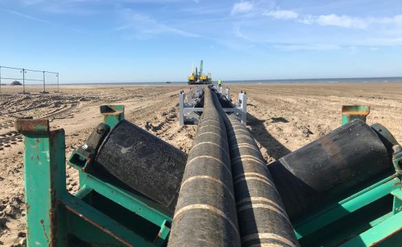 Interconnector cables being pulled across a beach - used for the National Grid article 'Connecting electricity systems for a greener Britain'