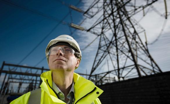 National Grid Project Manager Paul Daniels portrait with electricity pylon in the backrground