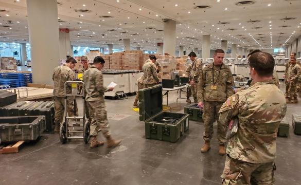 US military personnel in warehouse serving for National Guard - used for 'From National Grid to National Guard' story
