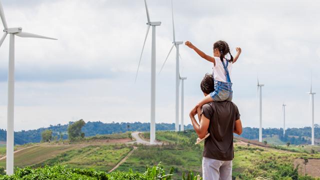 GirlSittingOnMan'sShouldersInFrontOfWindTurbines_640x360.jpg National Grid story 'Standing up to the climate change challenge'
