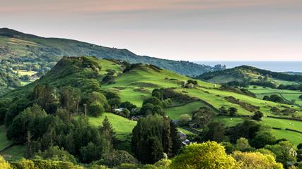 Green fields in the hills of Snowdonia - 427x240 Undulating green fields in hilly landscape