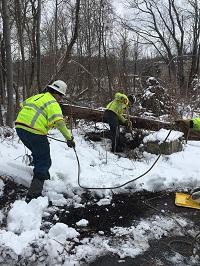 National Grid lineworkers digging small.jpg Two National Grid lineworkers digging in the snow in the US
