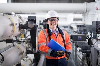 Suzanne Bryant_350x233.jpg Suzanne Bryant holding a file in a workshop environment.
