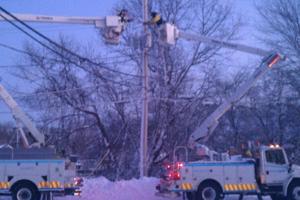 US bucket trucks in snow storm - 300x200.jpg US lineworkers repairing lines from National Grid buckete trucks in snow storm
