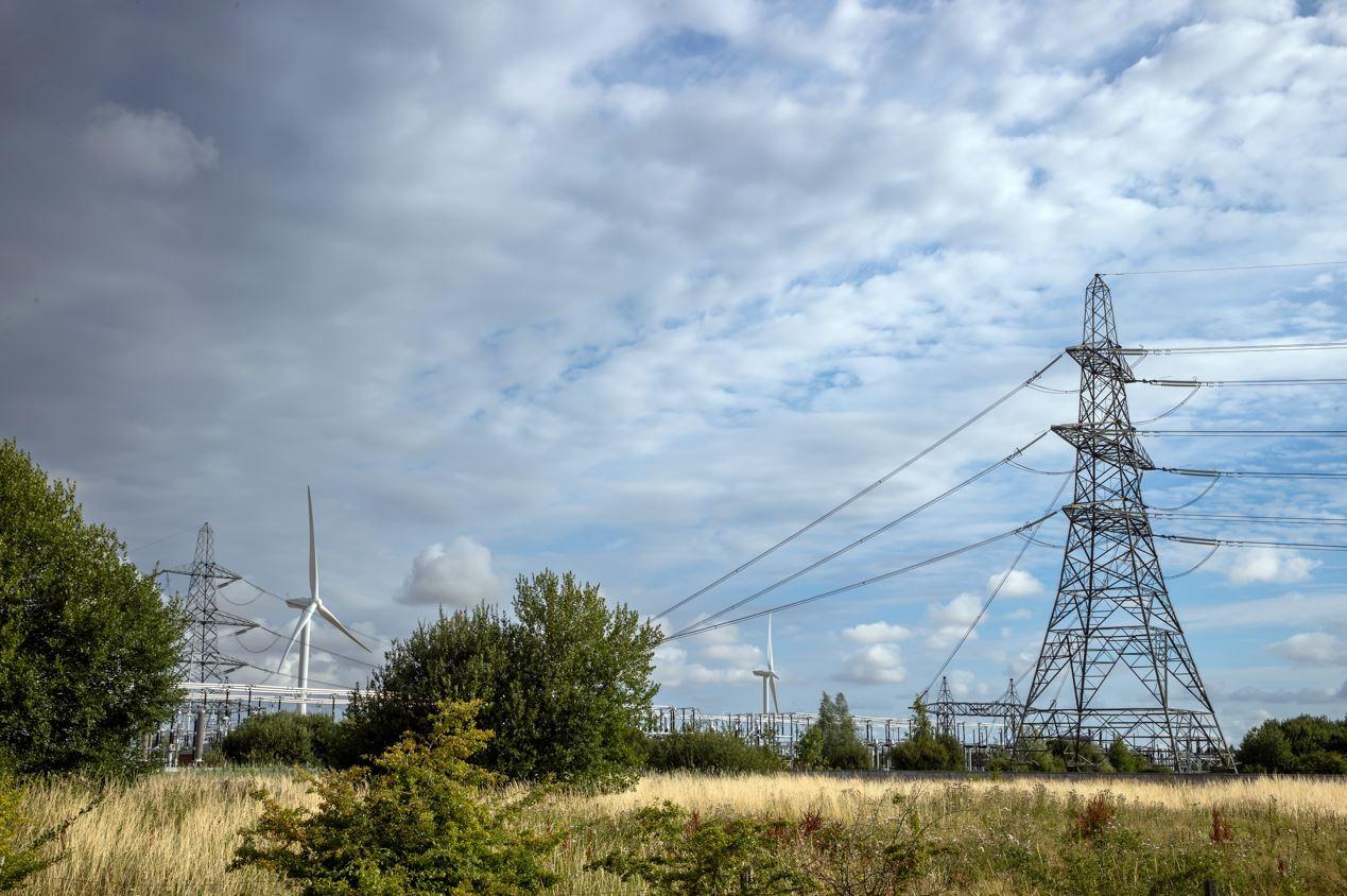 Bicker Fen Pylon.jpg Pylons and electricity transmission lines by an electricity substation with wind turbines in the background